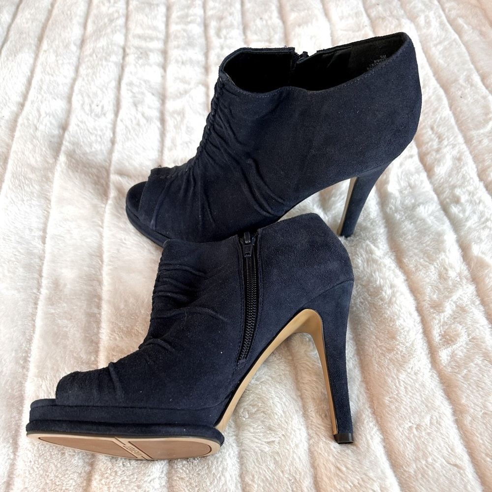 Navy suede bootie. Gathered in front.  Heel is 4.5 inches  front is 3/4 inches.